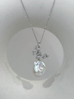 White iridescent baroque pearl necklace on a delicate silver chain