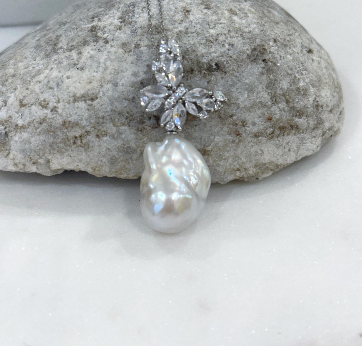 Elegant pearl pendant necklace featuring a naturally irregular shape