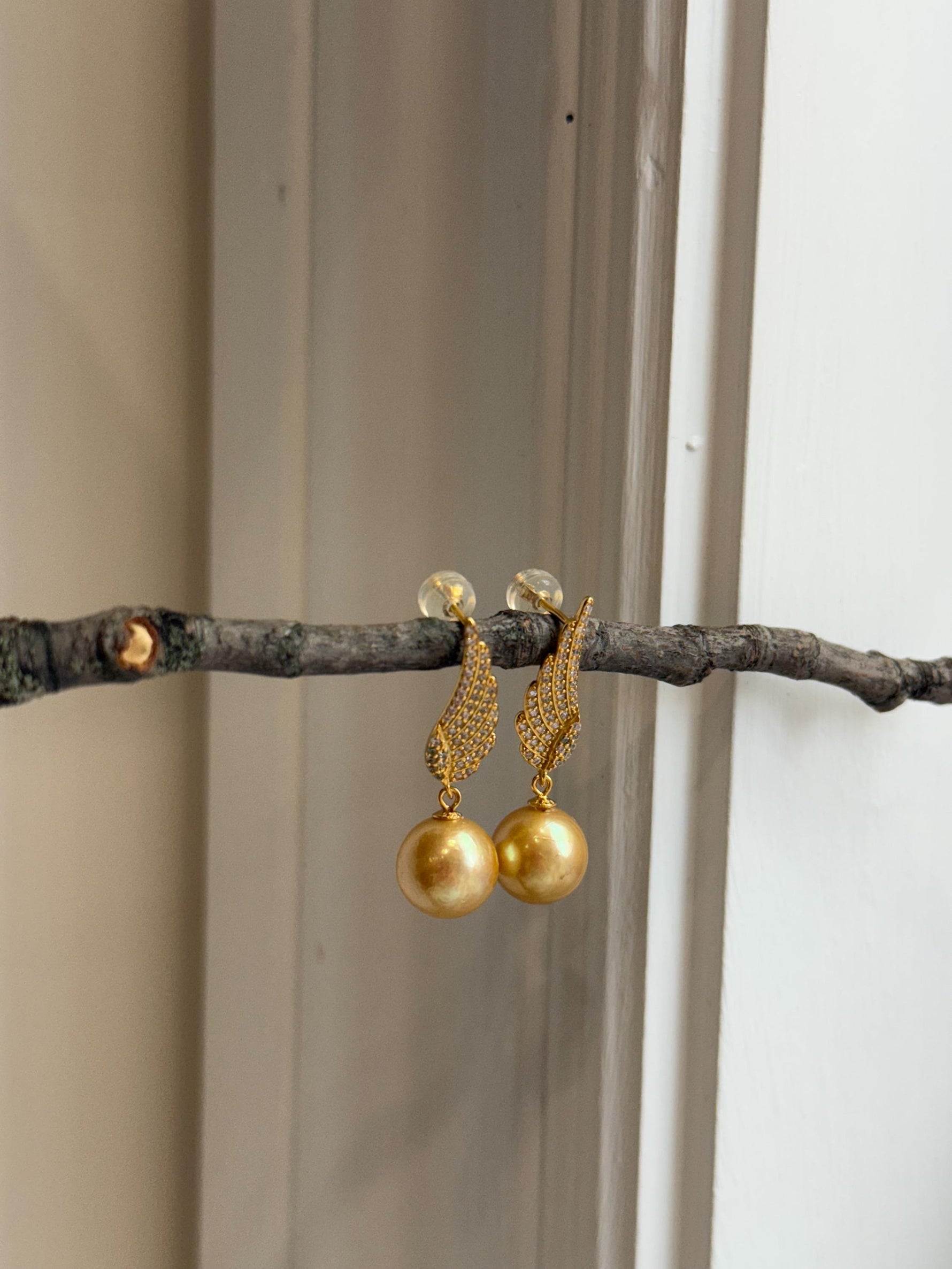 affordable freshwater golden pearls like south sea golden pearls s925 silver feather earrings for her office wear