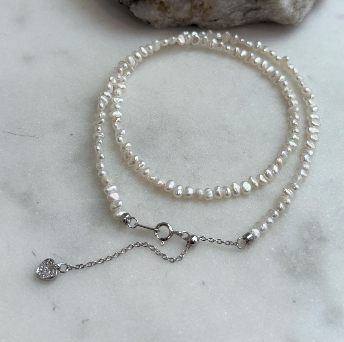 White small pearls necklace strand: Strong luster, 3.5-4mm long side, white iridescent Keshi pearls, s925 silver, to 16.9”.