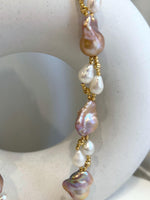 Baroque Rice Keshi Pearls Designed Necklace: 9pcs Extreme luster, peach rose iridescent, to 24mm, 18.3”