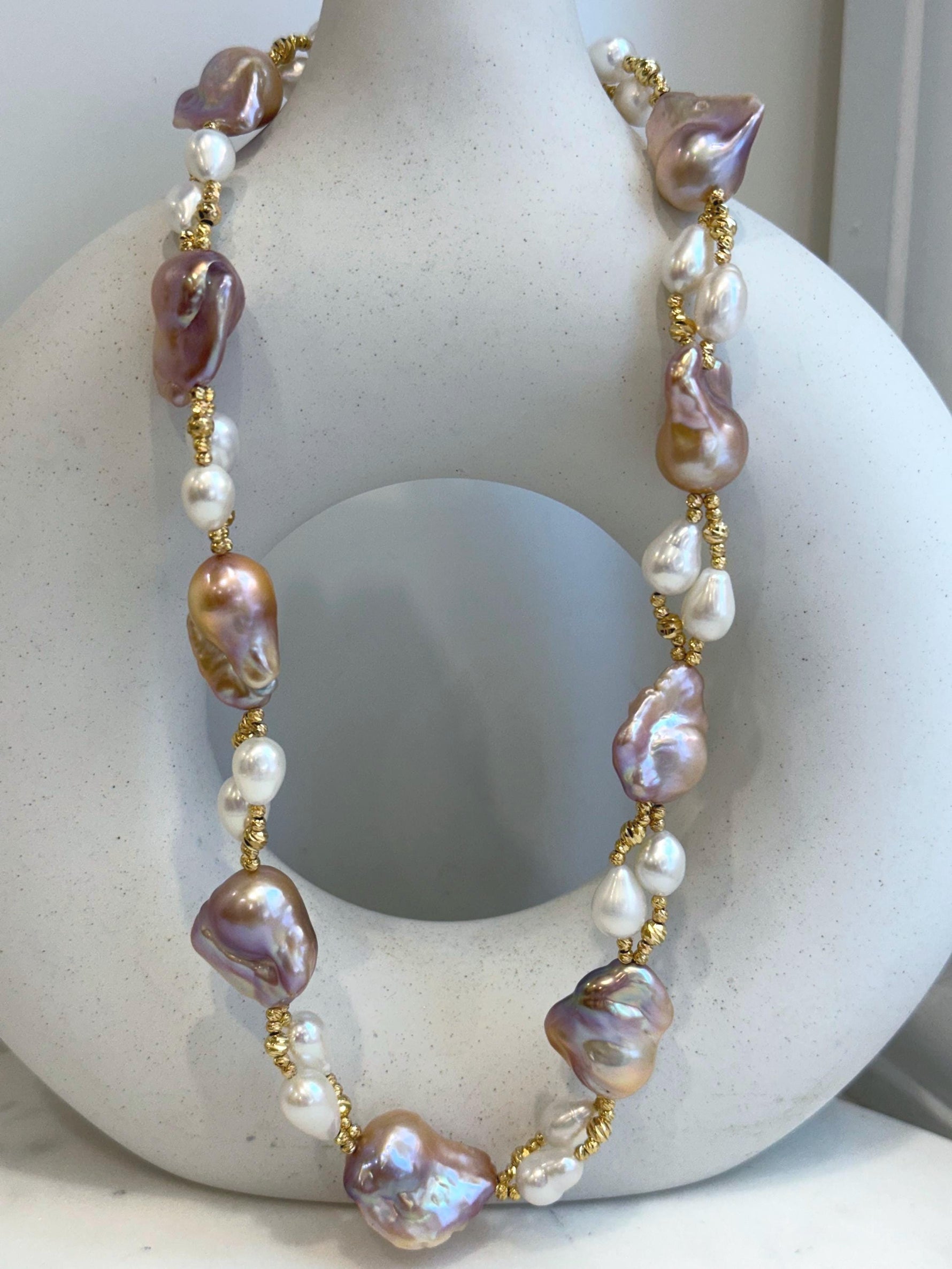 Baroque Rice Keshi Pearls Designed Necklace: 9pcs Extreme luster, peach rose iridescent, to 24mm, 18.3”