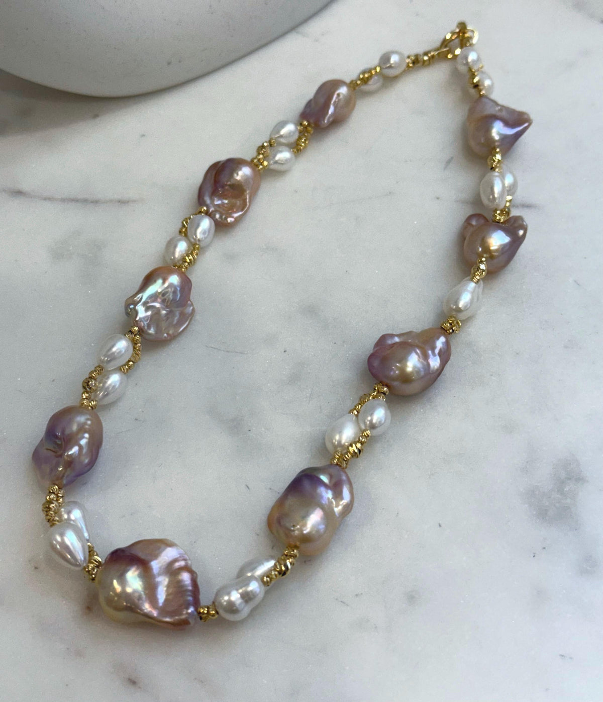 Baroque Rice Keshi Pearls Designed Necklace: 9pcs Extreme luster, peach rose iridescent, to 24mm, 18.3”