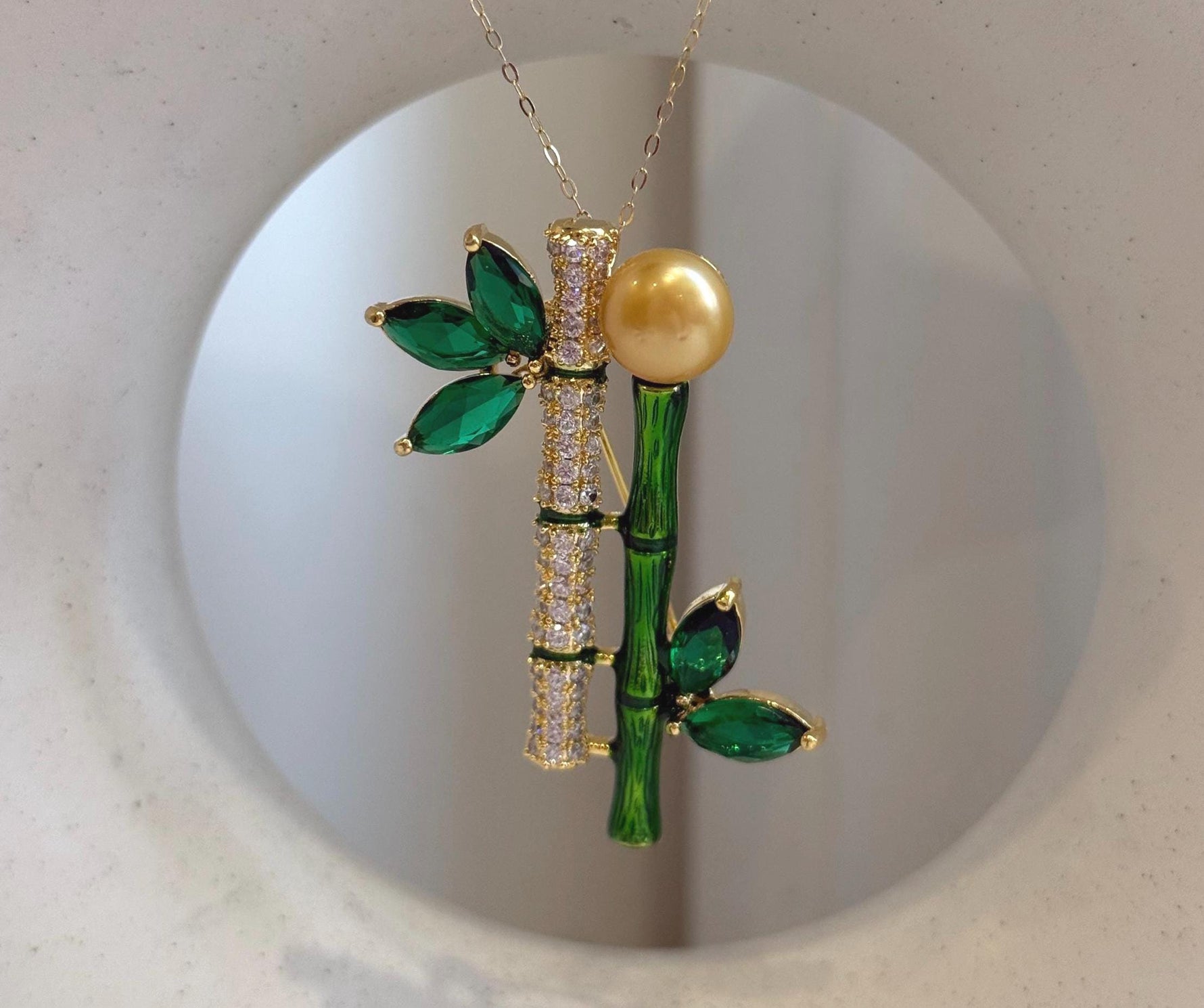 South sea golden pearl brooch pendant 2in1: Extreme luster mirrored, 9.5mm, ultra gold pearl, 2.3x4.8cm, Bamboo design Brooch.