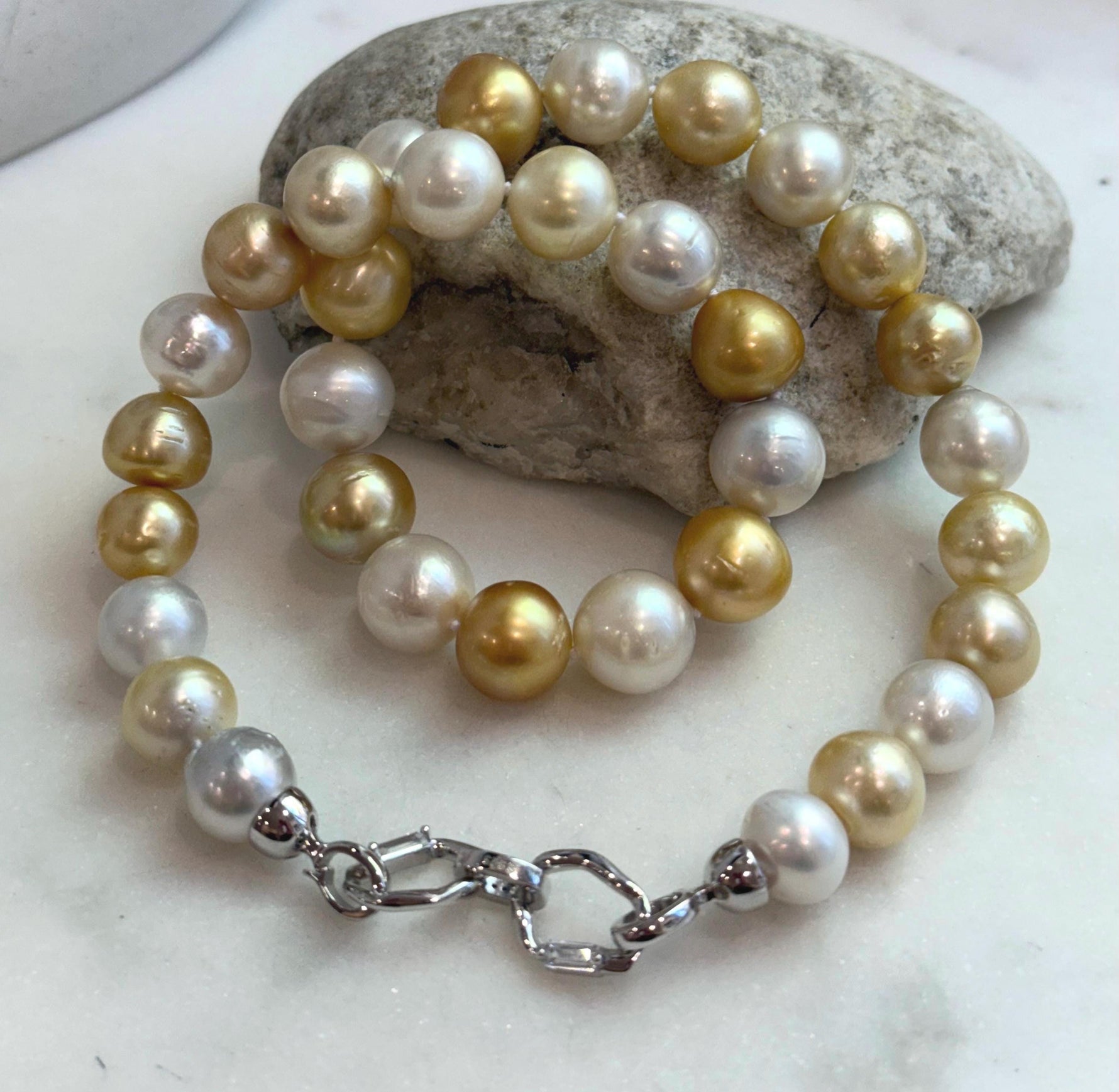 33pcs Strong luster South Sea Golden Australian Ocean White Pearls Necklace Strand: 10.7-12.8mm. Hand knotted 17.3”