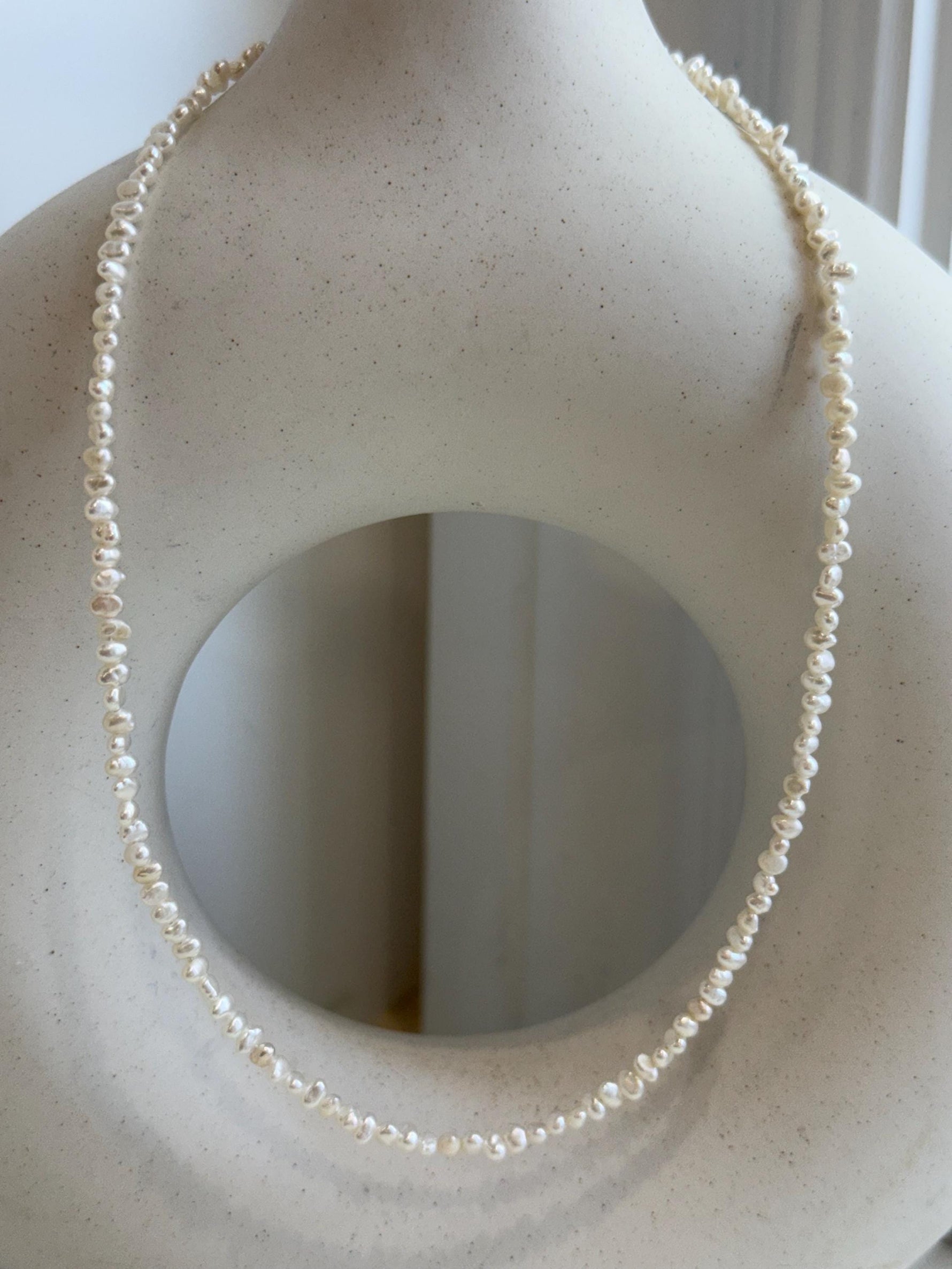 Not for seperate purchase. White small pearls necklace strand: Strong luster, 3.5-4mm long side, white iridescent Keshi pearls, s925 silver, to 16.9”.