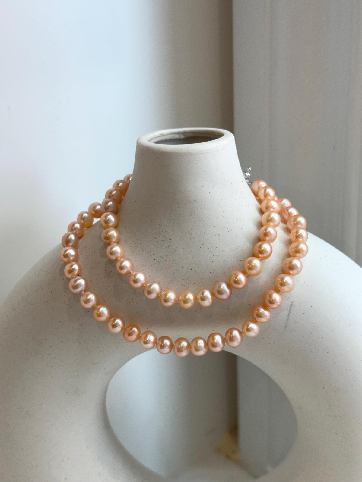 Peach Pearls Necklace: Extreme luster Mirrored effect, 6.2-6.7mm, S925 silver clips, knotted 17.8”long. No tariffs for her anniversary