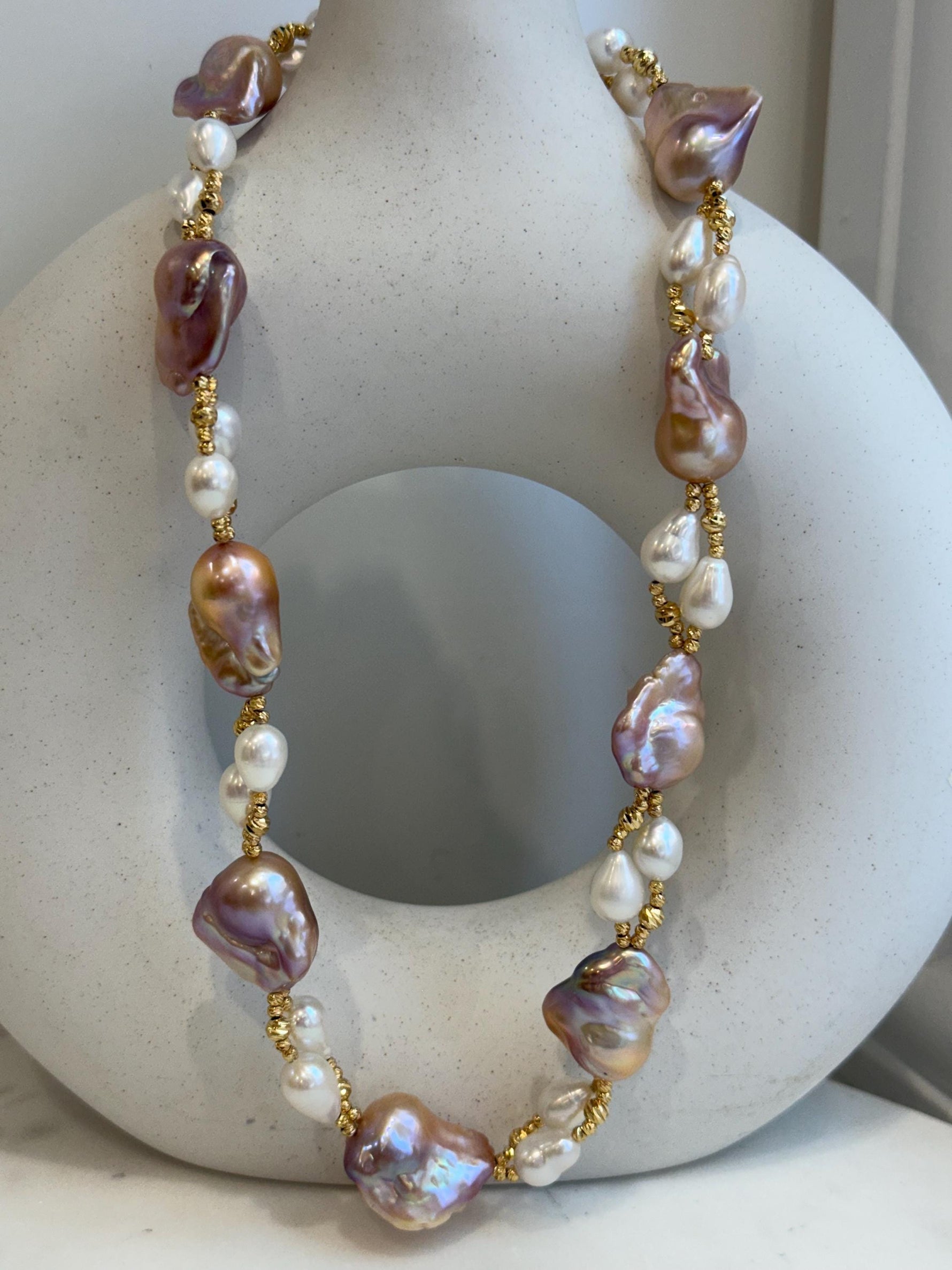 Baroque Rice Keshi Pearls Designed Necklace: 9pcs Extreme luster, peach rose iridescent, to 24mm, 18.3”