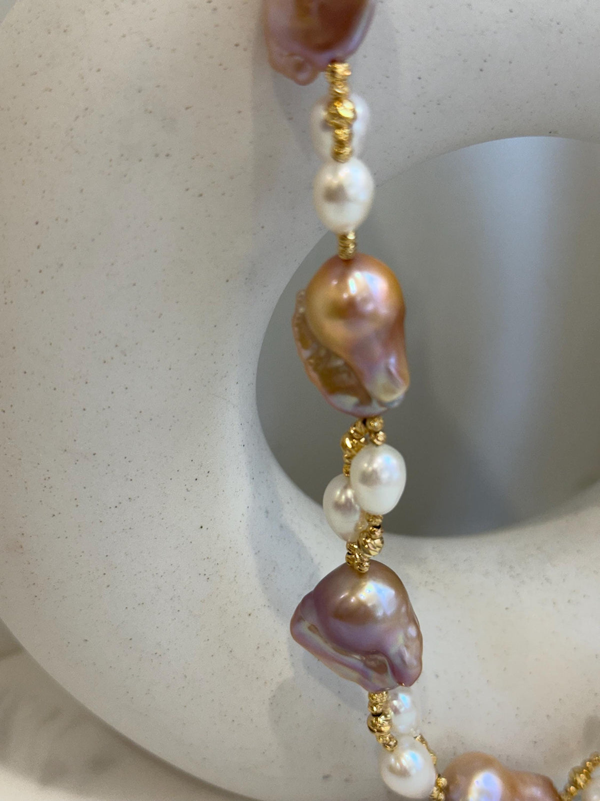 Baroque Rice Keshi Pearls Designed Necklace: 9pcs Extreme luster, peach rose iridescent, to 24mm, 18.3”