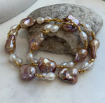 Baroque Rice Keshi Pearls Designed Necklace: 9pcs Extreme luster, peach rose iridescent, to 24mm, 18.3”