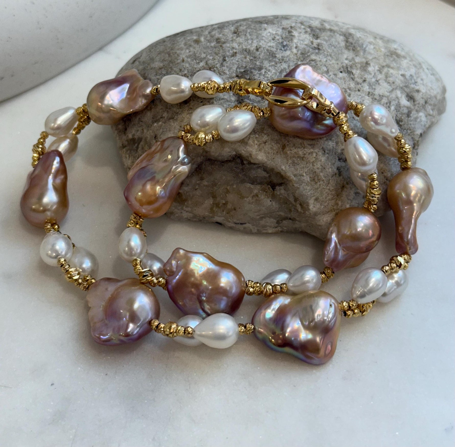 Baroque Rice Keshi Pearls Designed Necklace: 9pcs Extreme luster, peach rose iridescent, to 24mm, 18.3”
