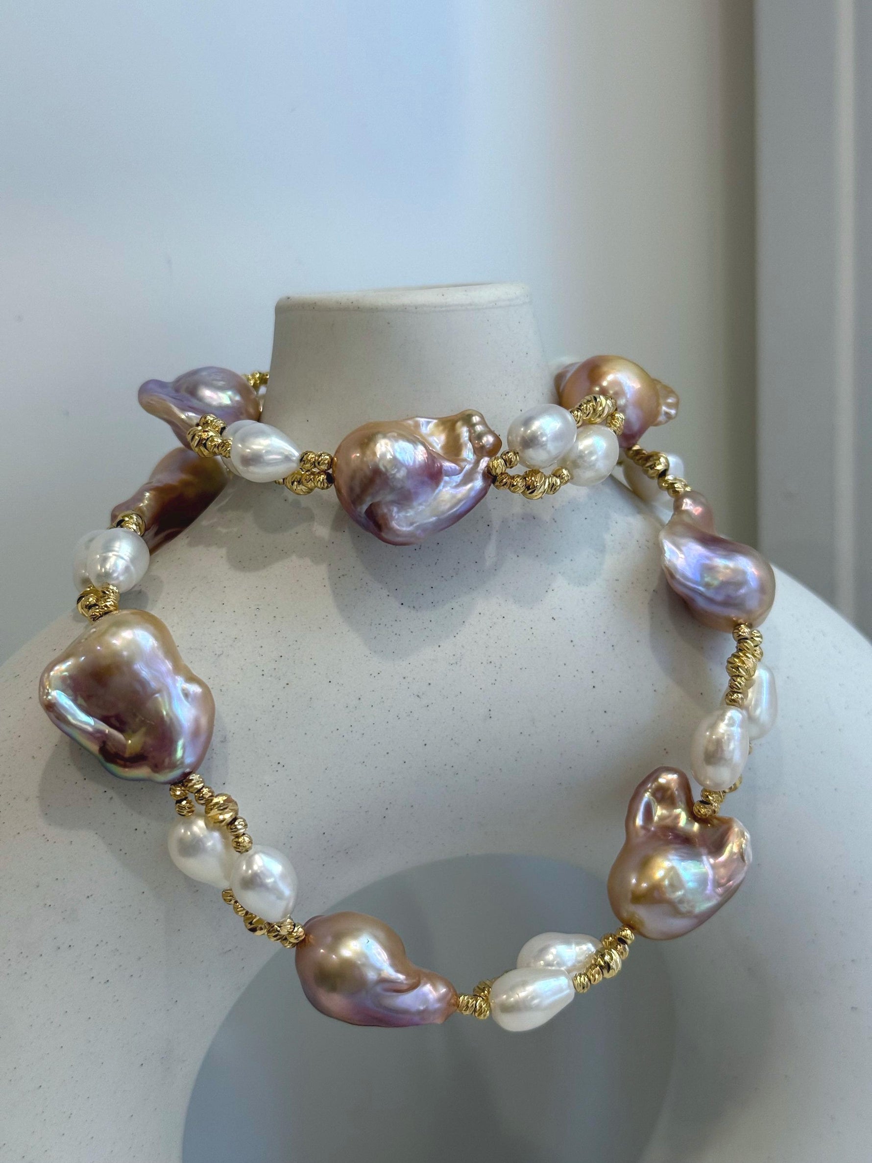 Baroque Rice Keshi Pearls Designed Necklace: 9pcs Extreme luster, peach rose iridescent, to 24mm, 18.3”