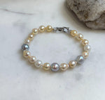 Multicolor Ocean Pearls Bracelet: 19pcs Akoya ocean Australian White ocean Pearls, Extreme luster, 6.7-8.5mm, 7.2” knotted