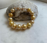10.8-13.1mm 12pcs South sea golden Ocean Pearls bracelet: strong luster, gold to deep golden pearls,S925 silver bracelet.