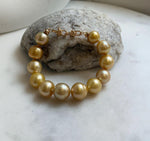 10.8-13.1mm 12pcs South sea golden Ocean Pearls bracelet: strong luster, gold to deep golden pearls,S925 silver bracelet.
