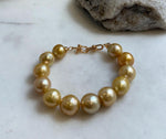 10.8-13.1mm 12pcs South sea golden Ocean Pearls bracelet: strong luster, gold to deep golden pearls,S925 silver bracelet.