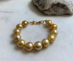 10.8-13.1mm 12pcs South sea golden Ocean Pearls bracelet: strong luster, gold to deep golden pearls,S925 silver bracelet.