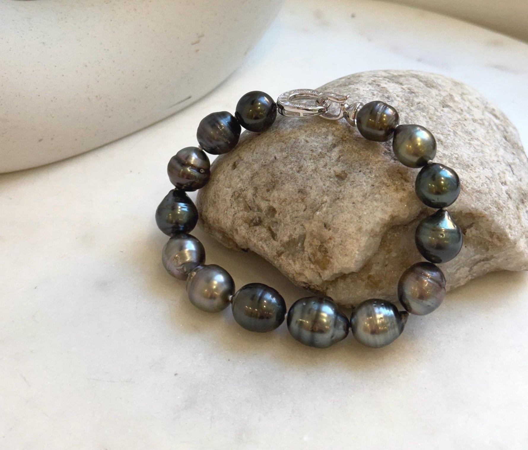 Elly’s 10.1-11.7mm 14pcs Tahitian Ocean peacock green huber Pearls Bracelet: Extreme luster, 8.1” knotted. Pearl jewelry idea.