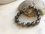 Elly’s 10.1-11.7mm 14pcs Tahitian Ocean peacock green huber Pearls Bracelet: Extreme luster, 8.1” knotted. Pearl jewelry idea.