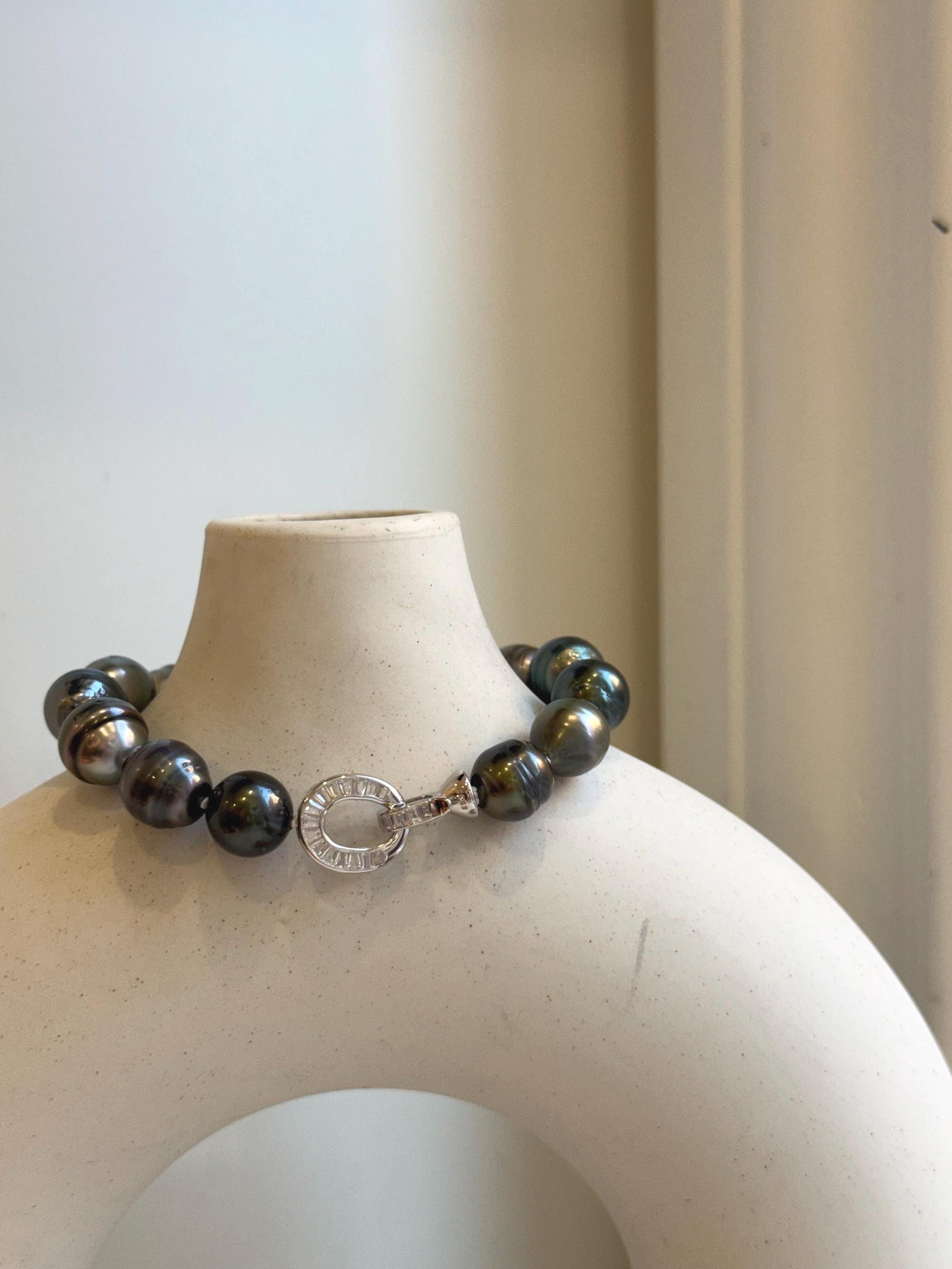 Elly’s 10.1-11.7mm 14pcs Tahitian Ocean peacock green huber Pearls Bracelet: Extreme luster, 8.1” knotted. Pearl jewelry idea.