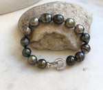 Elly’s 10.1-11.7mm 14pcs Tahitian Ocean peacock green huber Pearls Bracelet: Extreme luster, 8.1” knotted. Pearl jewelry idea.