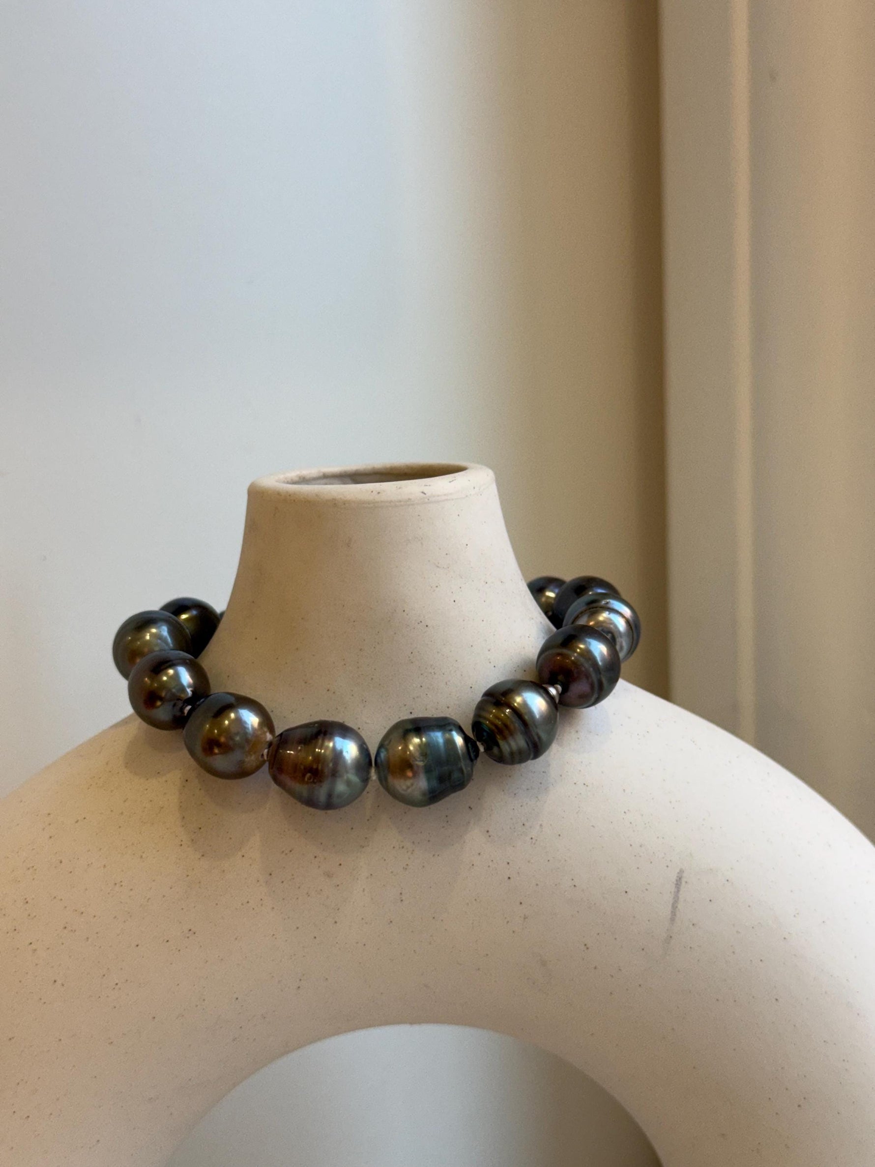 Elly’s 10.1-11.6mm 14pcs Tahitian Ocean peacock platinum Pearls Bracelet: Extreme luster, 7.8” knotted. Pearl jewelry idea.