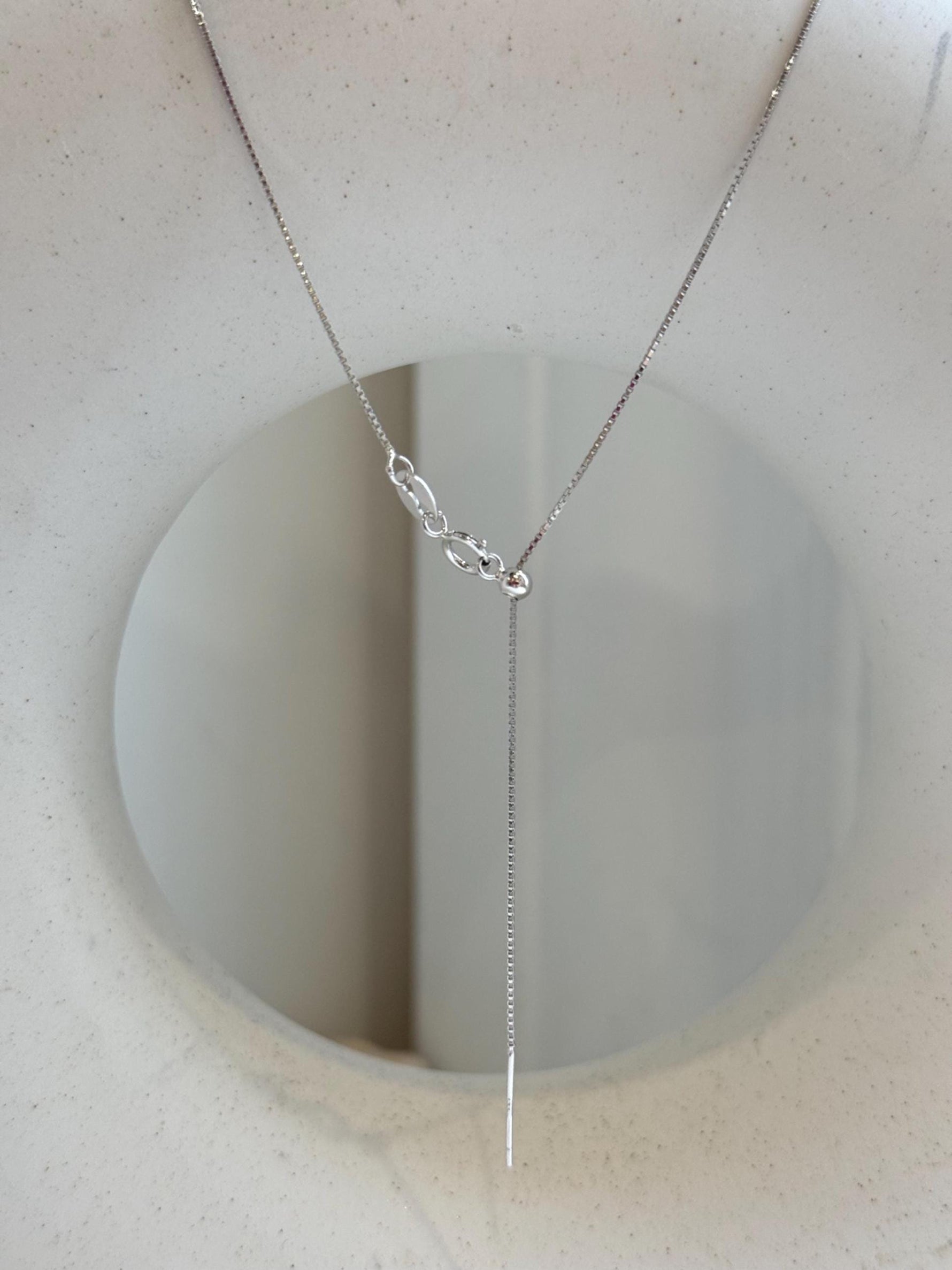 Not for seperate purchase!! 0.6mm thick s925 silver box chain necklace, adjustable size to 17.3”, with needle for floating pendant. Silver.