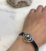 Elly’s 11.3mm Tahitian Platinum Ocean Pearl Genius Leather Strap Bracelet: extreme luster mirrored, for 6.1”- 8” wrist.