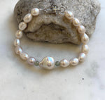 Elly’s 16pcs 7.1-13.1mm Baroque oval pearls Braclet: Extreme luster mirrored, 8”, S925 silver Braclet.