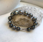 Elly’s 10.1-11.6mm 14pcs Tahitian Ocean peacock platinum Pearls Bracelet: Extreme luster, 7.8” knotted. Pearl jewelry idea. black pearl bracelet