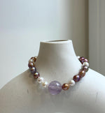 Elly’s 6.4-7.4mm Freshwater Pearls Bracelet: Extreme luster, 7.6” knotted, S925 silver clip bracelet with Amethyst.