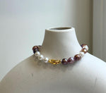 Elly’s 6.4-7.4mm Freshwater Pearls Bracelet: Extreme luster, 7.6” knotted, S925 silver clip bracelet with Amethyst.