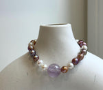 Elly’s 6.4-7.4mm Freshwater Pearls Bracelet: Extreme luster, 7.6” knotted, S925 silver clip bracelet with Amethyst.