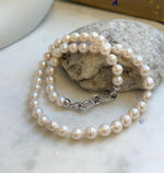 Elly’s 7.7-8.7mm 47pcs Akoya Ivory w/ pink hue ocean pearls necklace choker: Extreme luster mirrored, knotted, 18.2”, S925 silver necklace. gift for her