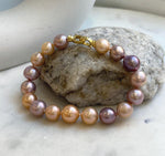 Elly’s 17pcs 9.3-11.2mm Natural Multicolor Edison Pearls Bracelet: Extreme luster mirrored, 8.3” knotted, S925 silver Bracelet.