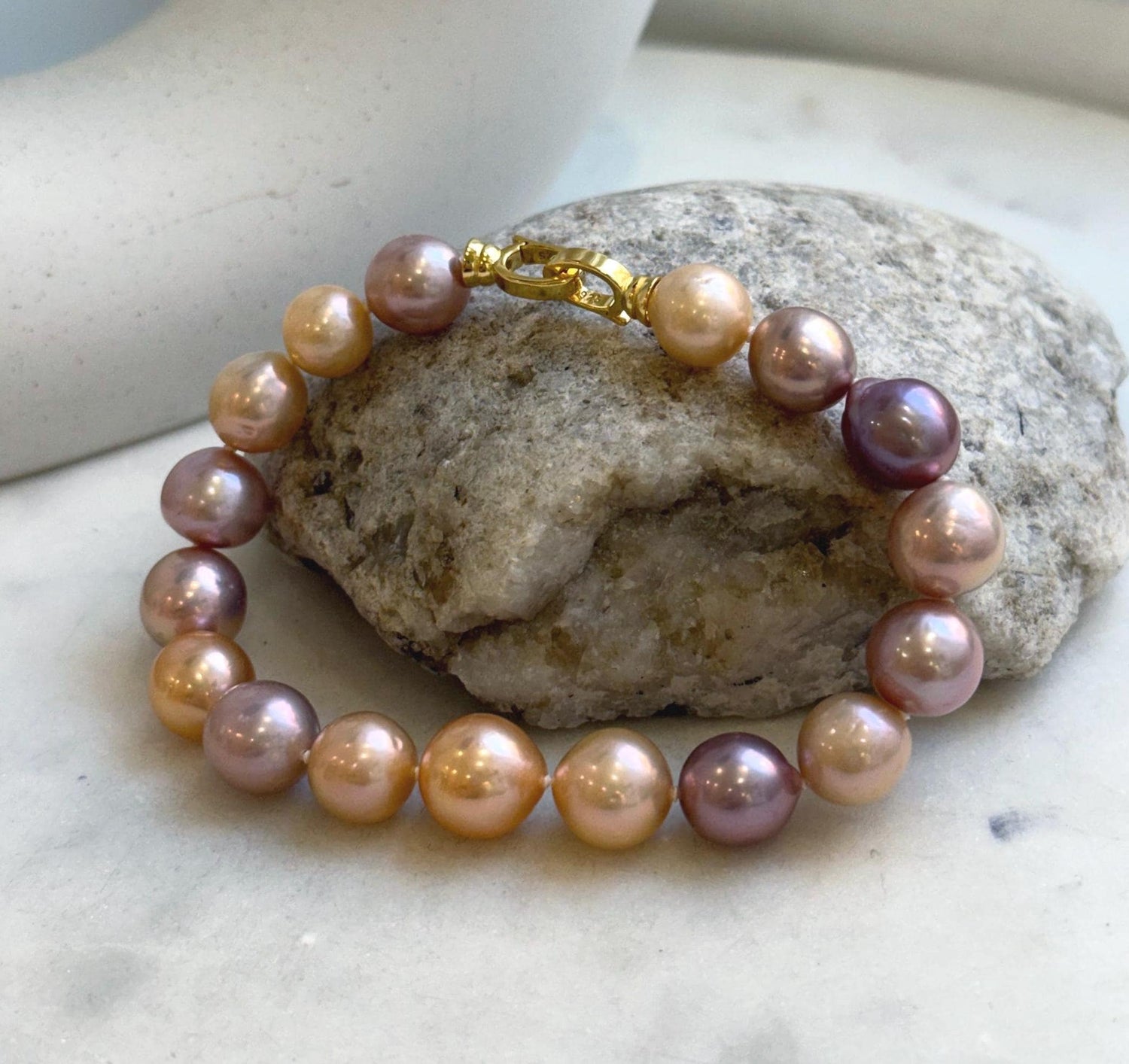 Elly’s 17pcs 9.3-11.2mm Natural Multicolor Edison Pearls Bracelet: Extreme luster mirrored, 8.3” knotted, S925 silver Bracelet.