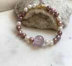 Elly’s 6.4-7.4mm Freshwater Pearls Bracelet: Extreme luster, 7.6” knotted, S925 silver clip bracelet with Amethyst.