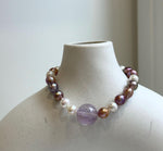 Elly’s 6.4-7.4mm Freshwater Pearls Bracelet: Extreme luster, 7.6” knotted, S925 silver clip bracelet with Amethyst.