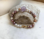 Elly’s 6.4-7.4mm Freshwater Pearls Bracelet: Extreme luster, 7.6” knotted, S925 silver clip bracelet with Amethyst.