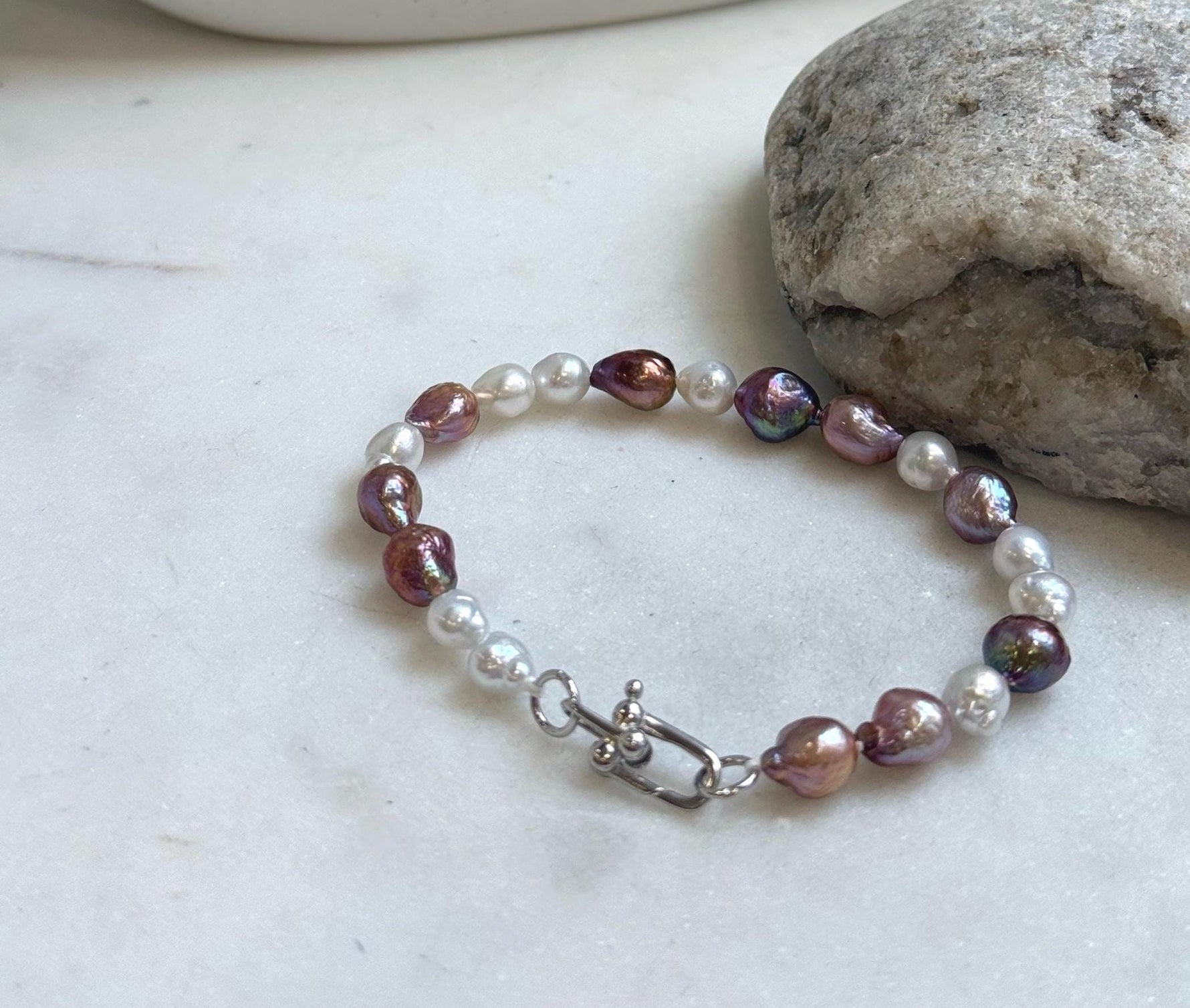 Elly’s 5-7.2mm Freshwater Pearls Bracelet: Extreme luster, 7.2” knotted, S925 silver clip bracelet.