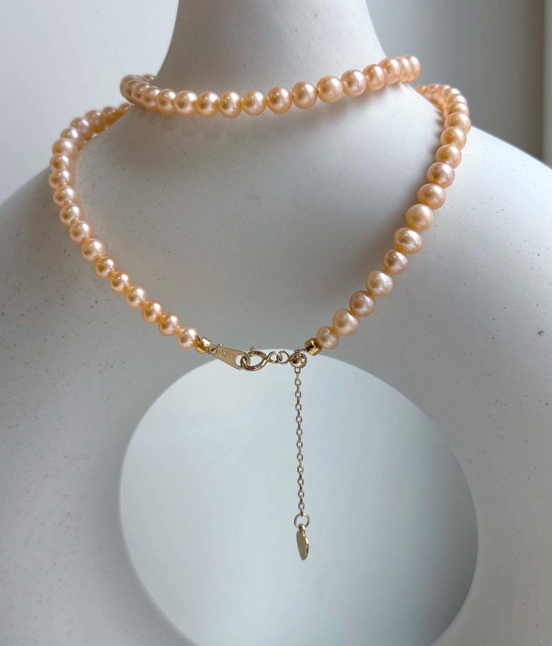 Elly’s Peach Pearls Necklace: Extreme luster Mirrored effect, 4.4-5.3mm, S925 silver clips, to 17.7”long.