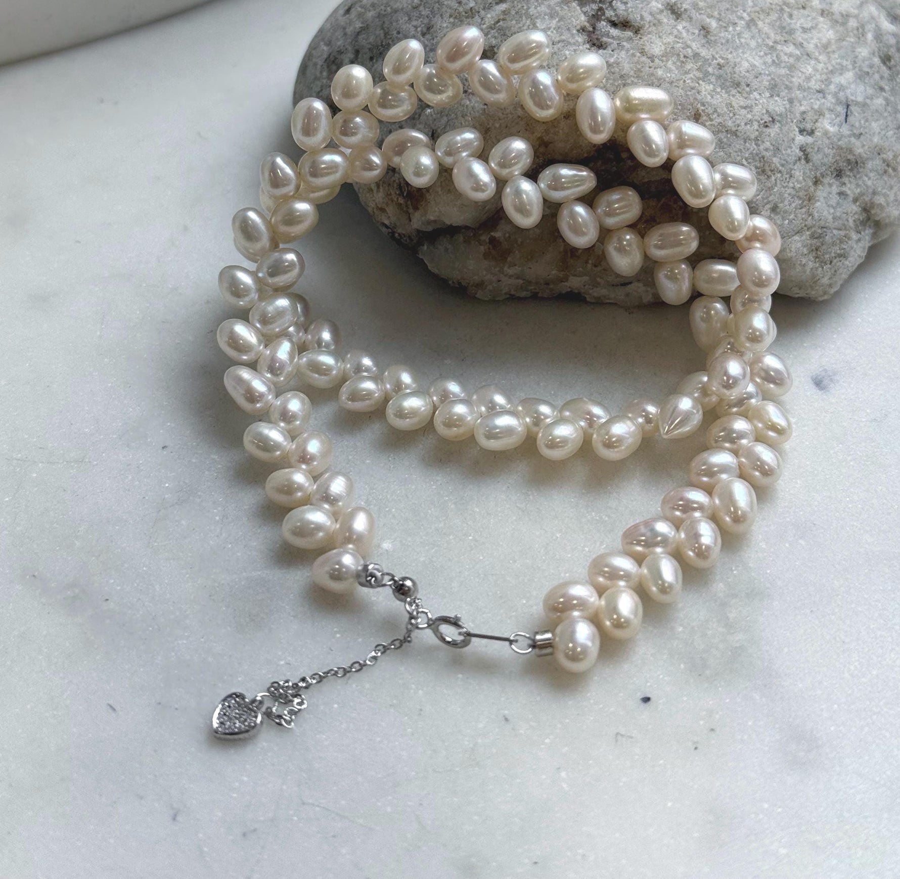 Elly’s White rice Keshi Pearls wheat design Necklace: Extreme luster Mirrored effect, 5-5.5mm, S925 silver clips, to 17.7”long.