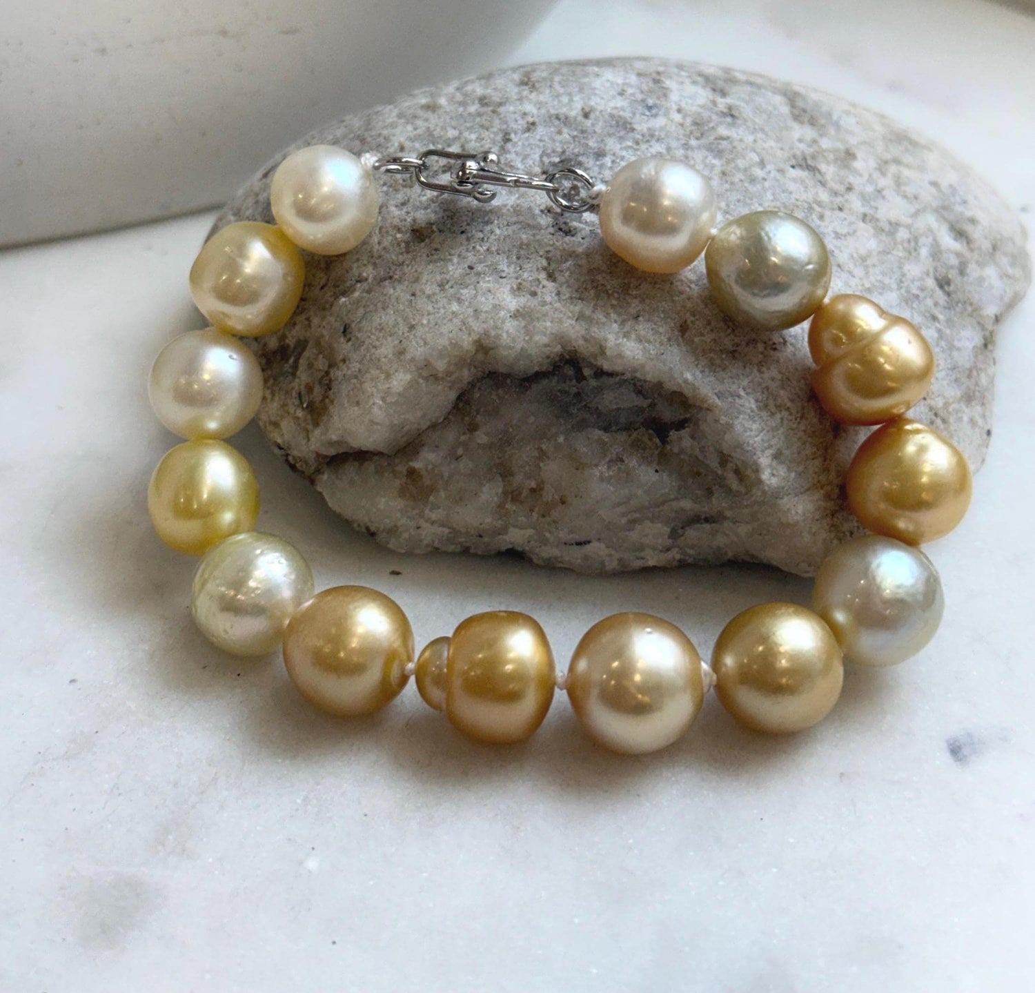 Elly’s 11.8-13.3mm 14pcs South sea golden Ocean Pearls bracelet: Extreme luster, light to deep golden pearls, 8.3”, S925 silver bracelet.