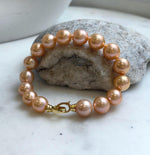 Elly’s 16pcs 9.8-11mm Natural Sunset Peach Gold Edison Pearls Bracelet: Extreme luster mirrored, 8” knotted, S925 silver Bracelet. gift for her
