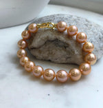 Elly’s 16pcs 9.8-11mm Natural Sunset Peach Gold Edison Pearls Bracelet: Extreme luster mirrored, 8” knotted, S925 silver Bracelet. gift for her holiday