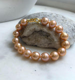 Elly’s 16pcs 9.8-11mm Natural Sunset Peach Gold Edison Pearls Bracelet: Extreme luster mirrored, 8” knotted, S925 silver Bracelet. gift for her