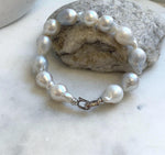 Elly’s 12pcs Australian Ocean white silver Pearls Bracelet: Extreme luster mirrored, to 18.2mm, 8.4” knotted, S925 silver clip.