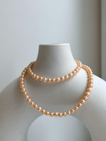 Elly’s Peach Pearls Necklace: Extreme luster Mirrored effect, 4.4-5.3mm, S925 silver clips, to 17.7”long.