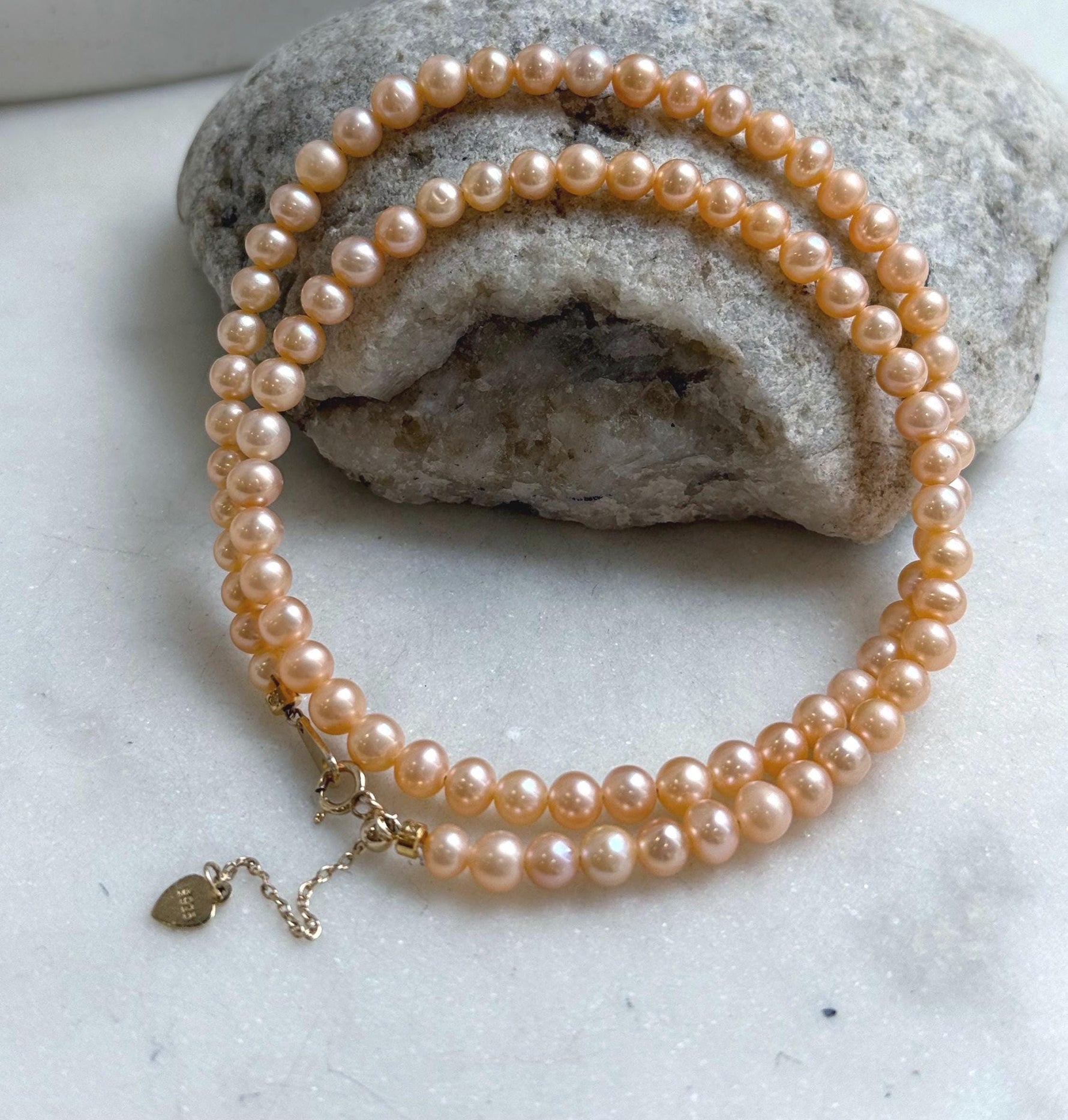 Elly’s Peach Pearls Necklace: Extreme luster Mirrored effect, 4.4-5.3mm, S925 silver clips, to 17.7”long.