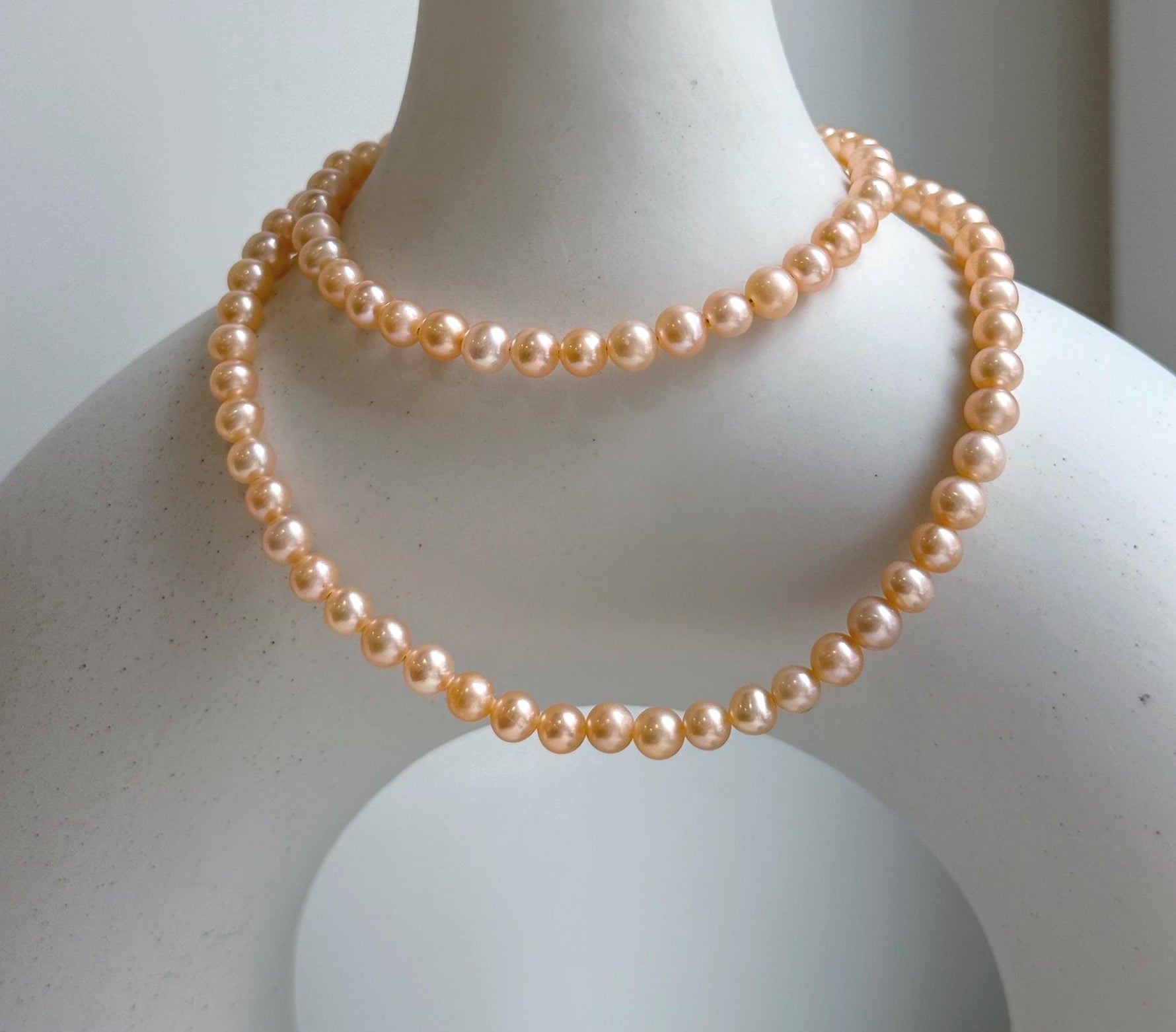 Elly’s Peach Pearls Necklace: Extreme luster Mirrored effect, 4.4-5.3mm, S925 silver clips, to 17.7”long.